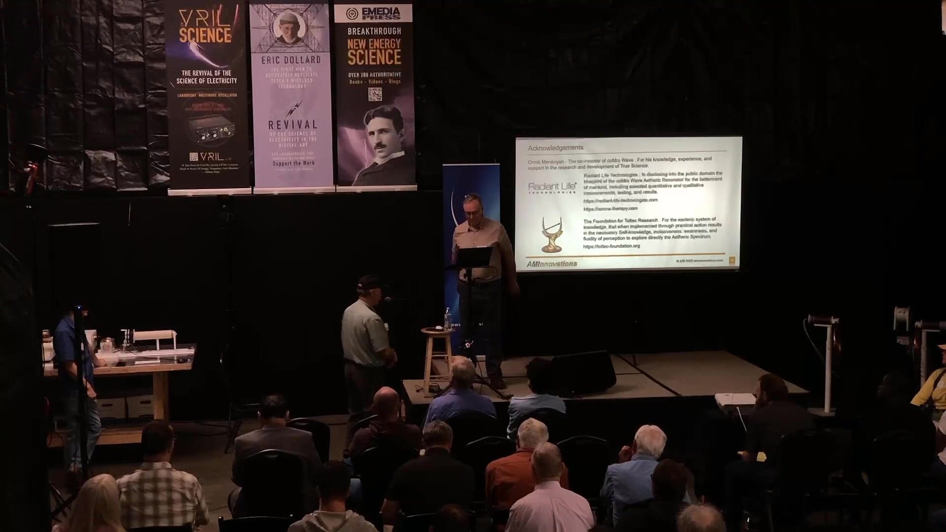 An attendee at the microphone reports on using a device during the conference while Adrian Marsh listens