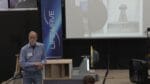 Peter Lindemann on stage with the wind-catcher models and box fan used for the live demonstration