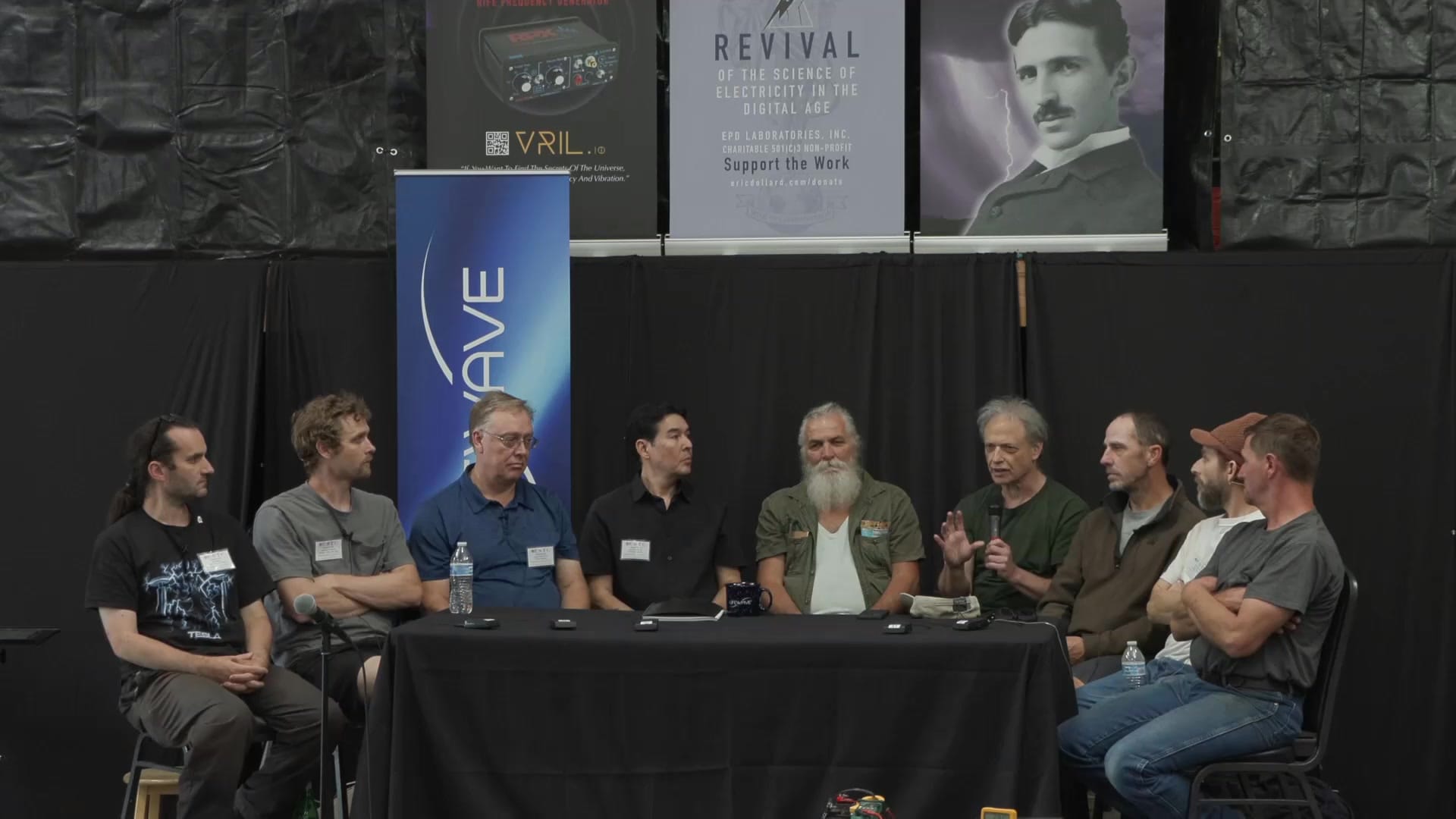 A panelist takes the microphone during the open Q and A